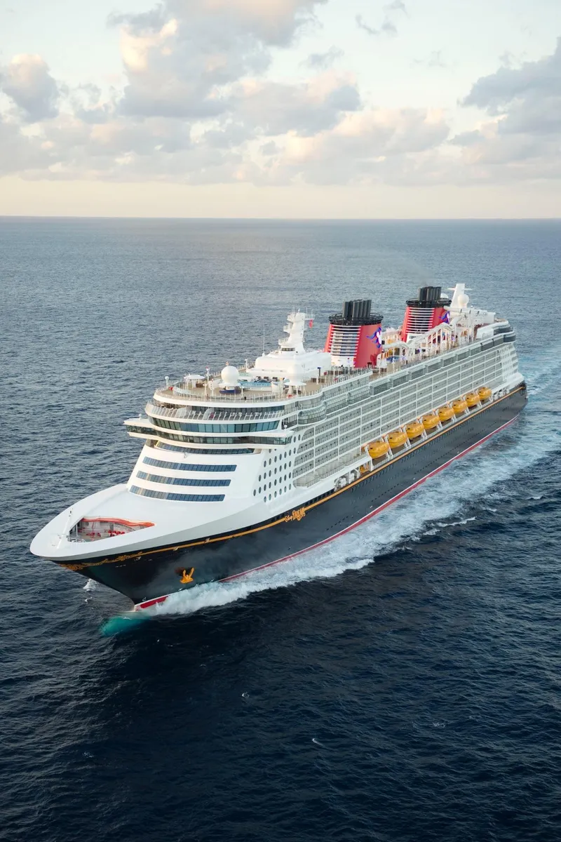 A Disney Cruise Line ship sailing on open ocean